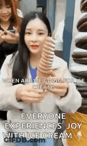 A Woman Is Holding A Large Ice Cream Cone And Asking When Are We Going For Ice Cream . GIF