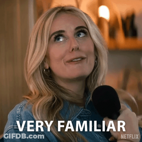 A Woman Is Holding A Microphone And Says Very Familiar On The Screen GIF