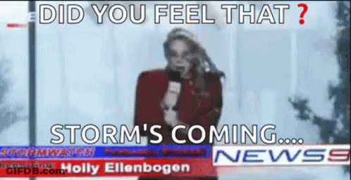 A Woman Is Holding A Microphone In Front Of A Newspaper Headline That Says Storm 'S Coming . GIF