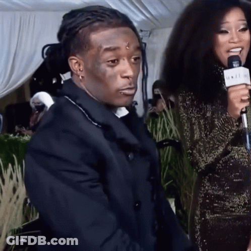 A Woman Is Holding A Microphone That Says ' N.i.i.i.i. ' On It GIF