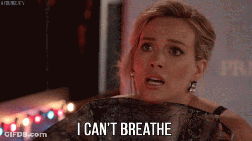 A Woman Is Holding A Piece Of Clothing And Saying I Can 'T Breathe GIF