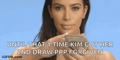A Woman Is Holding A Piece Of Paper That Says Until That Time Kim Got Her 2Nd Draw Ppp Forgiven GIF