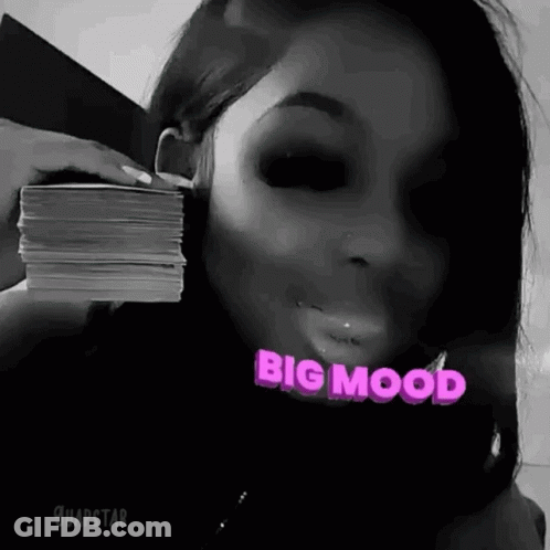 Woman Holding Pile Of Money In Front Of Face GIF