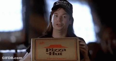 A Woman Is Holding A Pizza Hut Box In Her Hand . GIF