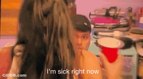 A Woman Is Holding A Red Cup And Saying I 'M Sick Right Now . GIF
