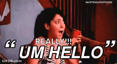 A Woman Is Holding A Red Cup And Saying `` Um Hello '' While Sitting On A Bed . GIF