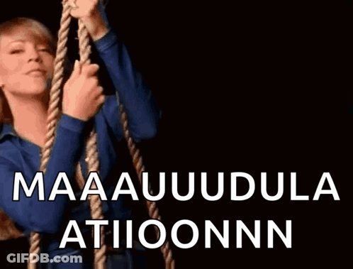 A Woman Is Holding A Rope With The Words Maaauudula Atiioonnn Written On It GIF