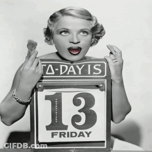 A Woman Is Holding A Sign That Says A-Day Is 13 Friday GIF