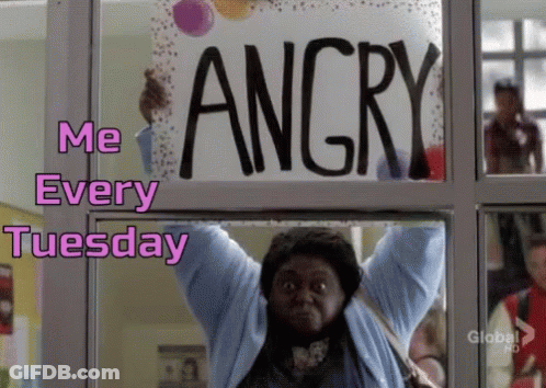 A Woman Is Holding A Sign That Says Angry Over Her Head GIF