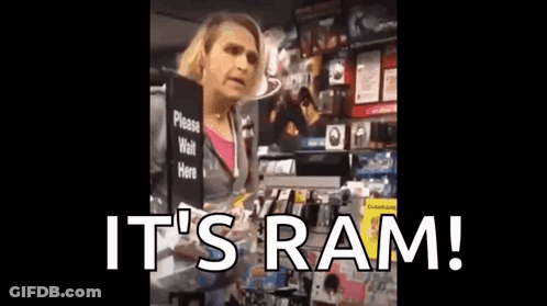 A Woman Is Holding A Sign That Says It 'S Ram . GIF