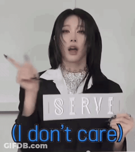 A Woman Is Holding A Sign That Says Serve I Don T Care GIF