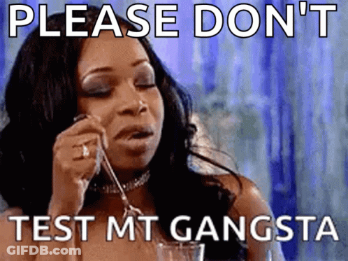 A Woman Is Holding A Spoon In Her Mouth And A Meme Says Please Don 'T Test Mt Gangsta GIF