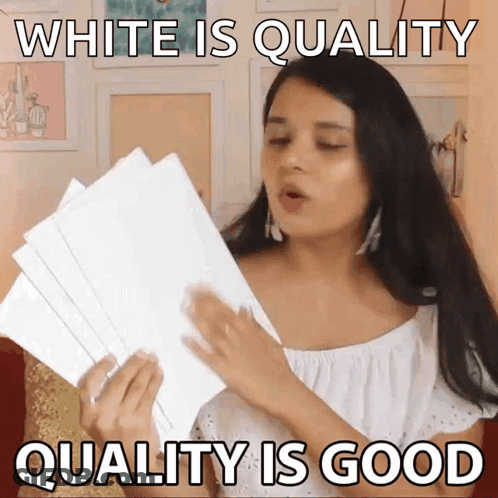 A Woman Is Holding A Stack Of White Papers And Says " White Is Quality Quality Is Good " GIF