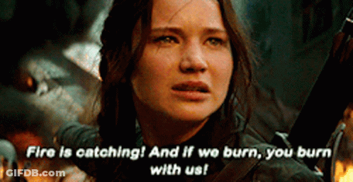 A Woman Is Holding A Sword And Says Fire Is Catching And If We Burn , You Burn With Us . GIF