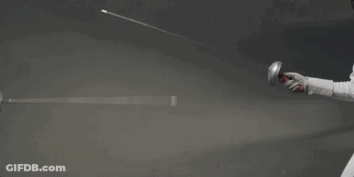 A Woman Is Holding A Sword In Her Hand While Wearing A Mask . GIF