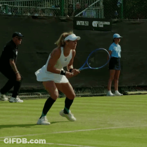 A Woman Is Holding A Tennis Racquet In Front Of A Challenger Tour Sign GIF