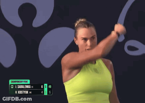 A Woman Is Holding A Tennis Racquet In Front Of A Championship Point GIF