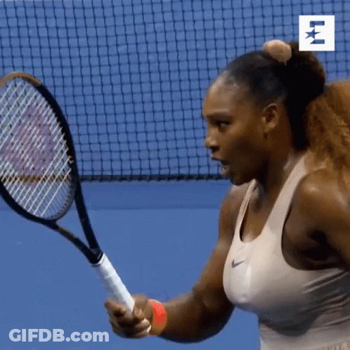 A Woman Is Holding A Tennis Racquet In Front Of A Net With The Letter E On It GIF