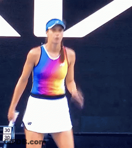A Woman Is Holding A Tennis Racquet In Front Of A Scoreboard That Says 30 GIF