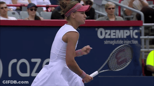 A Woman Is Holding A Tennis Racquet In Front Of A Sign That Says Ozempic GIF