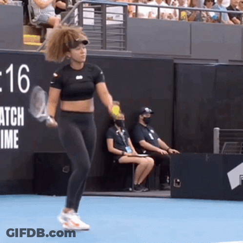 A Woman Is Holding A Tennis Racquet On A Tennis Court In Front Of A Sign That Says Match Time GIF