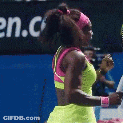A Woman Is Holding A Tennis Racquet With A Wilson Logo On It GIF