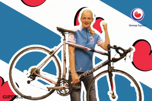 A Woman Is Holding A Trek Bicycle In Front Of A Blue And White Background GIF
