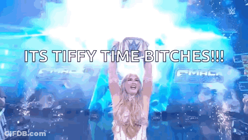 A Woman Is Holding A Trophy In The Air With The Words " Its Tiffy Time Bitches " Written Below Her GIF