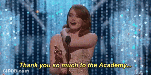 A Woman Is Holding An Oscar Trophy And Saying Thank You So Much To The Academy GIF
