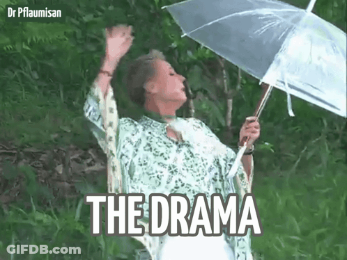 A Woman Is Holding An Umbrella In The Rain And The Word The Drama Is On The Bottom Right GIF