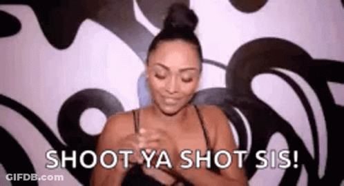 A Woman Is Holding Her Breasts In Front Of A Wall And Says `` Shoot Ya Shot Sis ! '' GIF