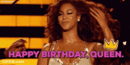 A Woman Is Holding Her Hair With The Words Happy Birthday Queen Above Her GIF