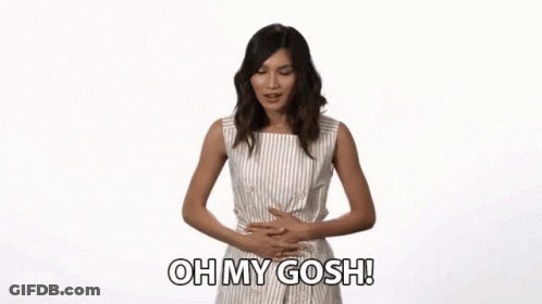 A Woman Is Holding Her Stomach And Says Oh My Gosh GIF