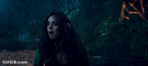 A Woman Is Holding Something In Her Hand And The Word Surprise Is On The Bottom Right GIF