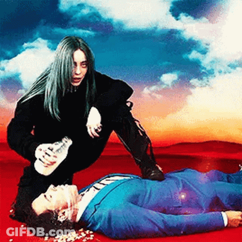 Woman Kneeling Over Laying Man In Suit GIF