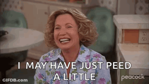 A Woman Is Laughing And Saying `` I May Have Just Peed A Little '' In A Kitchen . GIF