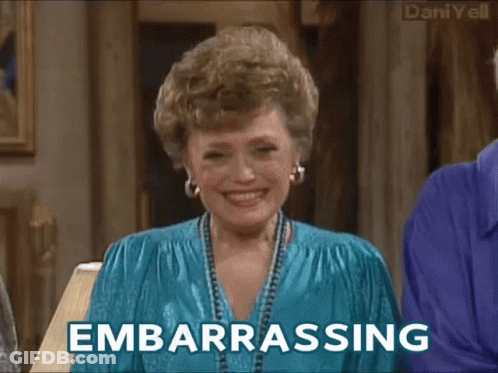 A Woman Is Laughing And The Word Embarrassing Is On The Bottom GIF
