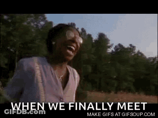 A Woman Is Laughing In A Field With The Words When We Finally Meet . GIF