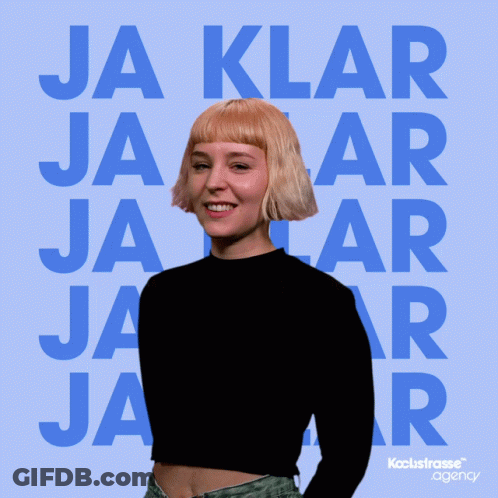 A Woman Is Laughing In Front Of A Blue Background That Says Ja Klar Jaar GIF