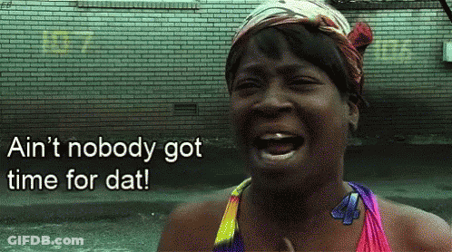 A Woman Is Laughing In Front Of A Brick Wall And Says Ain 'T Nobody Got Time For Dat ! GIF
