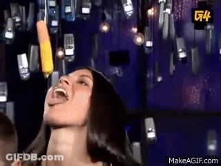 A Woman Is Laughing While Holding A Pencil In Her Mouth . GIF