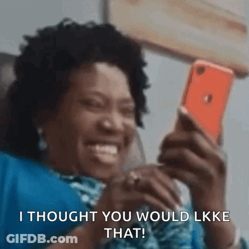 A Woman Is Laughing While Looking At Her Phone And Says I Thought You Would Like That . GIF
