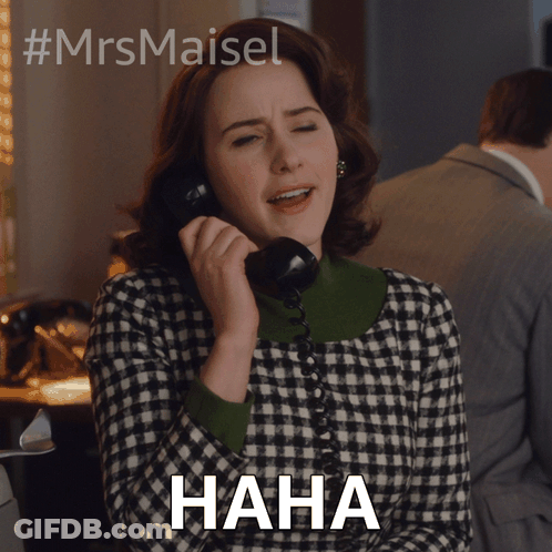 A Woman Is Laughing While Talking On A Phone And The Word Haha Is Below Her GIF