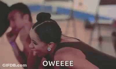 A Woman Is Laughing With A Man In A Gym And The Words Oweee Are On The Screen . GIF