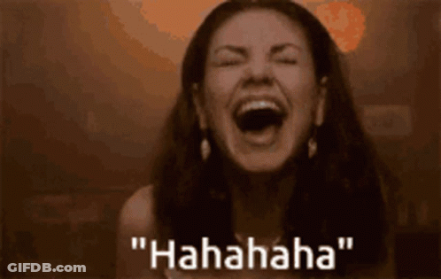 A Woman Is Laughing With Her Mouth Open And The Words " Hahahaha " Written Below Her GIF