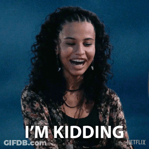A Woman Is Laughing With The Words I 'M Kidding Written Below Her GIF