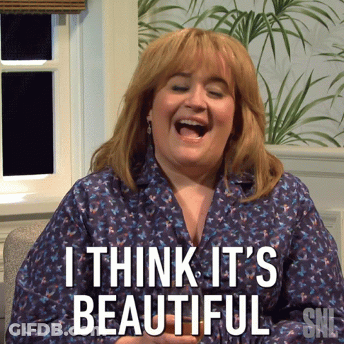 A Woman Is Laughing With The Words I Think It 'S Beautiful On Her Shirt GIF