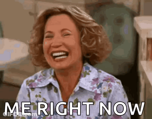 A Woman Is Laughing With The Words `` Me Right Now '' Written Next To Her . GIF