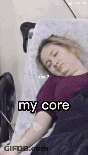 A Woman Is Laying In A Hospital Bed With An Iv In Her Arm And The Words `` She ? My Core '' . GIF