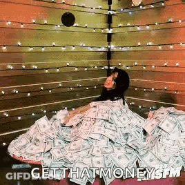A Woman Is Laying In A Pile Of Money With The Words Get That Money On The Bottom . GIF